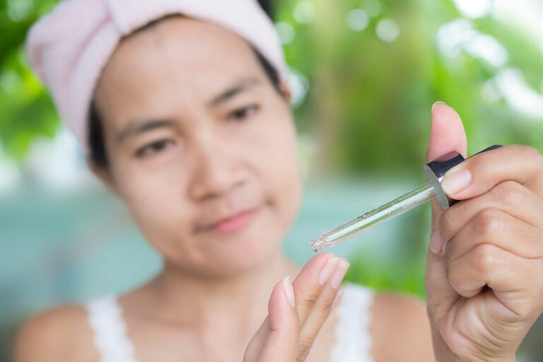 Woman holding serum for face